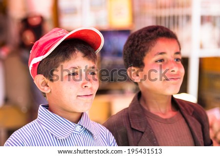 SANA\'A, YEMEN - JAN 11, 2014: Unidentified Yemeni boys wark at the market. People of Yemen suffer of poverty due to the unstable political and poor economical situation