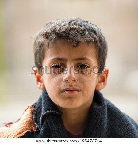 SANA\'A, YEMEN - JAN 11, 2014: Unidentified Yemeni boy portrait in Sana\'a. Children of Yemen grow up without education