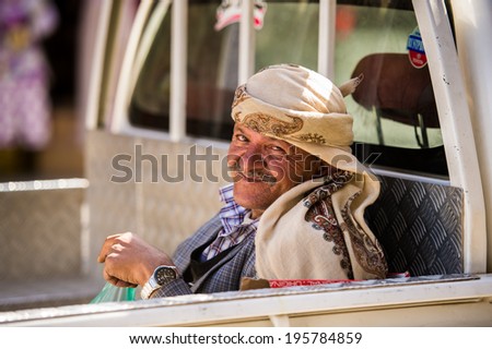 SANA\'A, YEMEN - JAN 11, 2014: Unidentified Yemeni smiling man in a turban in Sana\'a. People of Yemen suffer of poverty due to the unstable political and poor economical situation