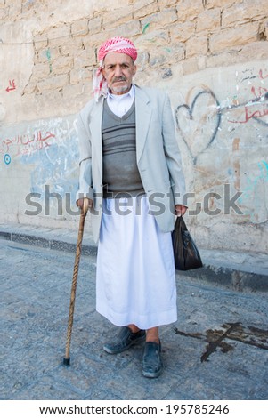 SANA\'A, YEMEN - JAN 11, 2014: Unidentified Yemeni old man in the street. People of Yemen suffer of poverty due to the unstable political and poor economical situation