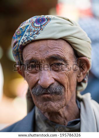 SANA\'A, YEMEN - JAN 11, 2014: Unidentified Yemeni man in a turban in Sana\'a. People of Yemen suffer of poverty due to the unstable political and poor economical situation