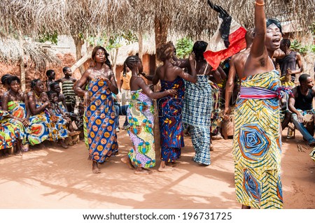 KARA, TOGO - MAR 11, 2012:  Unidentified Togolese women in a traditional dress dancethe religious voodoo dance. Voodoo is the West African religion