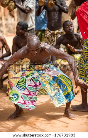 KARA, TOGO - MAR 11, 2012:  Unidentified Togolese man dances the religious voodoo dance. Voodoo is the West African religion