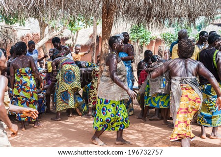 KARA, TOGO - MAR 11, 2012:  Unidentified Togolese women in a traditional dress dance the religious voodoo dance. Voodoo is the West African religion