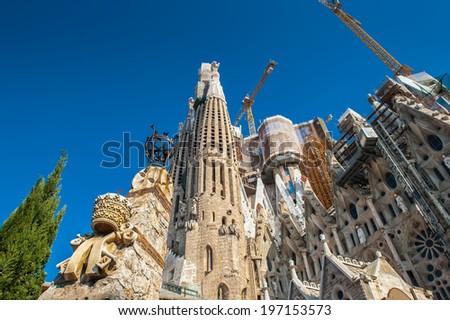 BARCELONA, SPAIN - MAR 15, 2014: Basilica and Expiatory Church of the Holy Family, is a Roman Catholic church in Barcelona, Spain, designed by Antoni Gaudi. UNESCO World Heritage Site