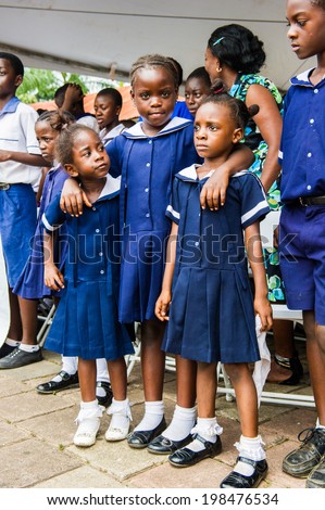 ACCRA, GHANA - MARCH 4, 2012: Unidentified Ghanaian students during the  local street show in Ghana. Children of Ghana suffer of poverty due to the unstable economic situation