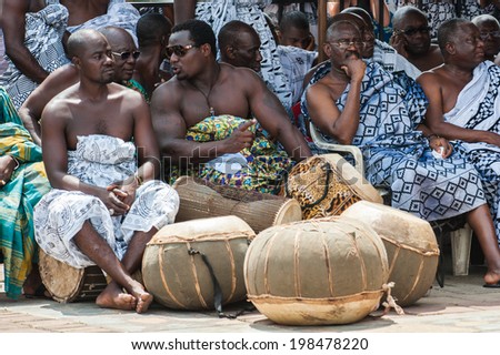 ACCRA, GHANA - MARCH 5, 2012: Unidentified Ghanaian people make local street music show in Ghana. People of Ghana suffer of poverty due to the unstable economic situation