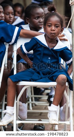 ACCRA, GHANA - MARCH 4, 2012: Unidentified Ghanaian girl in a school uniform in Ghana. School uniform is a part of the humanitarian help to Africa from the others countries