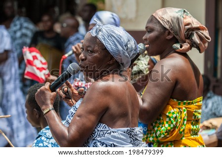 ACCRA, GHANA - MARCH 4, 2012: Unidentified Ghanaian woman sings a song in Ghana. Music is the main kind of entertainment in Africa