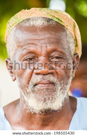 ACCRA, GHANA - MARCH 6, 2012: Unidentified Ghanaian old man with a beard in the street in Ghana. People of Ghana suffer of poverty due to the unstable economic situation