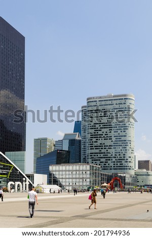 PARIS, FRANCE - JUN 18, 2014: Modern glass architecture of the La Defense district. La Defense is the major business district of the Paris, France