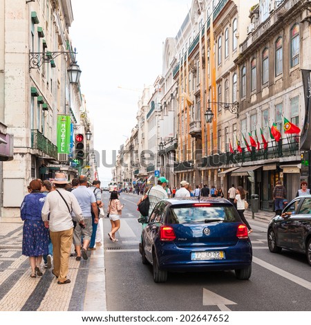LISBON, PORTUGAL - JUN 20, 2014:  Unidentified people walk in the touristic area in Lisbon, Portugal. Lisbon is the westernmost large city Europe and the seventh-most-visited city in Southern Europe