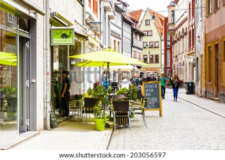 ERFURT, GERMANY  - JUN 16, 2014:  Small street of the city of Erfurt, Germany. Erfurt is the Capital of Thuringia and the city was first mentioned in 742