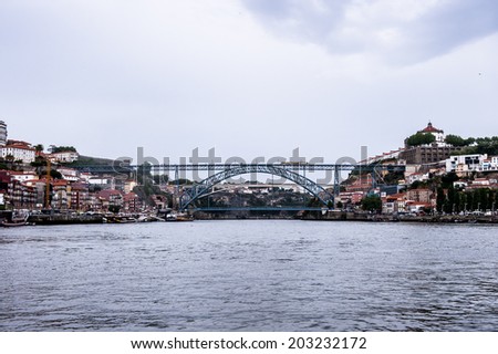 PORTO, PORTUGAL - JUN 21, 2014: Bridge Dom Luis I, Porto, Portugal. View from the River Douro, one of the major rivers of the Iberian Peninsula (2157 m)