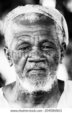 ACCARA, GHANA - MAR 6, 2012: Unidentified Ghanayan man portrait in the street in black and white. People of Ghana suffer of poverty due to the unstable economical situation