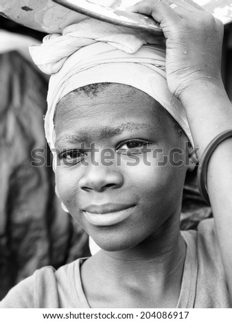 ACCARA, GHANA - MAR 3, 2012: Unidentified Ghanaian woman portrait in black and white. People of Ghana suffer of poverty due to the unstable economical situation