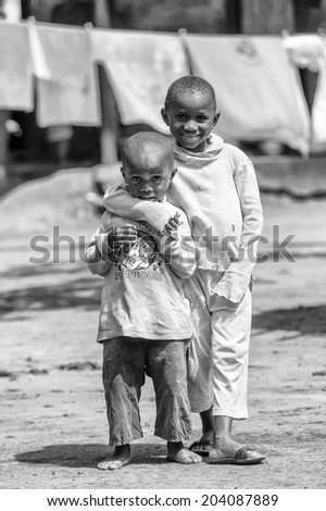 ACCARA, GHANA - MAR 4, 2012: Unidentified Ghanaian two boys portrait in black and white. People of Ghana suffer of poverty due to the unstable economical situation