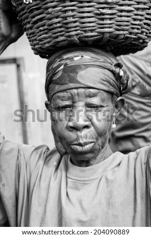 ACCARA, GHANA - MAR 3, 2012: Unidentified Ghanaian old woman portrait in black and white. People of Ghana suffer of poverty due to the unstable economical situation