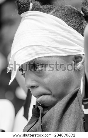 ACCARA, GHANA - MAR 4, 2012: Unidentified Ghanaian boy portrait in black and white. People of Ghana suffer of poverty due to the unstable economical situation