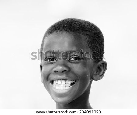 ACCARA, GHANA - MAR 3, 2012: Unidentified Ghanaian boy portrait in black white. People of Ghana suffer of poverty due to the unstable economical situation