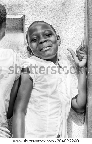 ACCARA, GHANA - MAR 3, 2012: Unidentified Ghanaian girl portrait in black and white. People of Ghana suffer of poverty due to the unstable economical situation