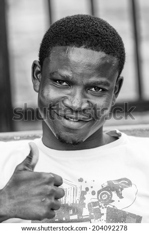 ACCARA, GHANA - MAR 3, 2012: Unidentified Ghanaian man portrait in black and white. People of Ghana suffer of poverty due to the unstable economical situation