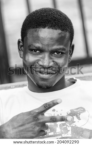 ACCARA, GHANA - MAR 3, 2012: Unidentified Ghanaian man portrait in black and white. People of Ghana suffer of poverty due to the unstable economical situation