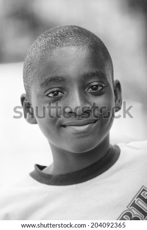 ACCARA, GHANA - MAR 3, 2012: Unidentified Ghanaian boy portrait in black and white. People of Ghana suffer of poverty due to the unstable economical situation
