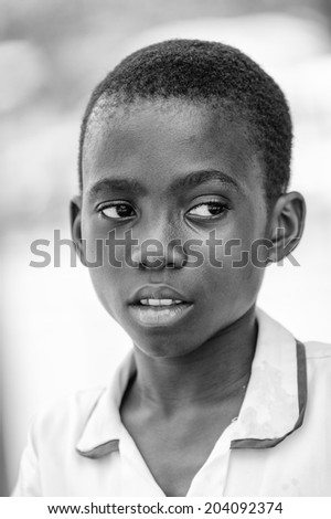 ACCARA, GHANA - MAR 3, 2012: Unidentified Ghanaian boy portrait in black and white. People of Ghana suffer of poverty due to the unstable economical situation