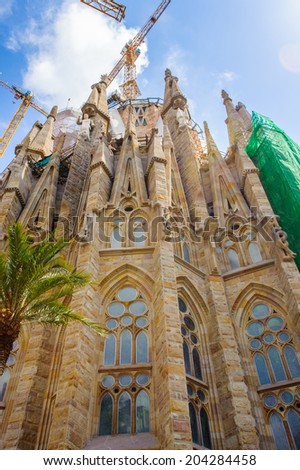 BARCELONA, SPAIN - JUN 23, 2014: Basilica and Expiatory Church of the Holy Family, is a Roman Catholic church in Barcelona, Spain, designed by Antoni Gaudi. UNESCO World Heritage Site