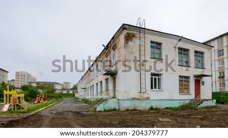 MAGADAN, RUSSIA - JUL 4, 2014: Old Kinder  garden on the Yakutskaya street in Magadan, Russia. Magadan was founded in 1929 and now it's the administrative centre of the Magadan region.
