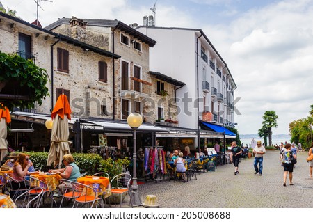 SIRMIONE, ITALY - JUNE 26, 2014: Touristic area in the Old Town of Sirmione, Italy. Sirmione became popular touristic destination on the Lake garda, the largest lake in Italy