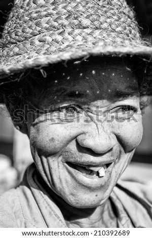 MADAGASCAR - JULY 1, 2011: Portrait of an unidentified woman in a red hat in Madagascar, July 1, 2011. People of Madagascar suffer of poverty due to the unstable situation.
