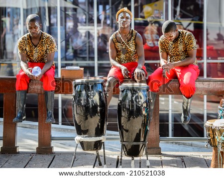 CAPE TOWN, SOUTH AFRICA - FEB 22, 2013: Unidentified musicians play the drums in the port of Cape Town, South Africa. Cape town is the most popular international touristic destination in Africa