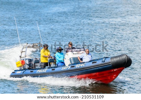 CAPE TOWN, SOUTH AFRICA - FEB 22, 2013: Unidentified people on a boat in the harbor in Cape Town, South Africa. Cape town is the most popular international touristic destination in Africa