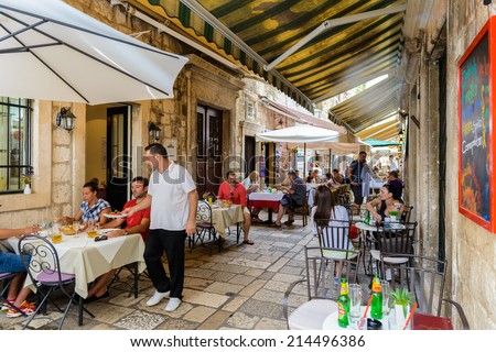 DUBROVNIK, CROATIA - AUG 21, 2014: Small restaurant of the Old town of Dubrovnik, Croatia. Dubrovnik is a UNESCO World Heritage site