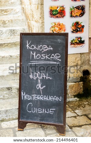 DUBROVNIK, CROATIA - AUG 21, 2014: Small restaurant menu of the Old town of Dubrovnik, Croatia. Dubrovnik is a UNESCO World Heritage site