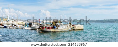 DALMATIA, CROATIA - AUG 24, 2014: Boats near the Coast of Croatia, on the Adriatic Sea. Catchment areaof the Adriatic Sea is 235,000 km2 (91,000 sq mi)