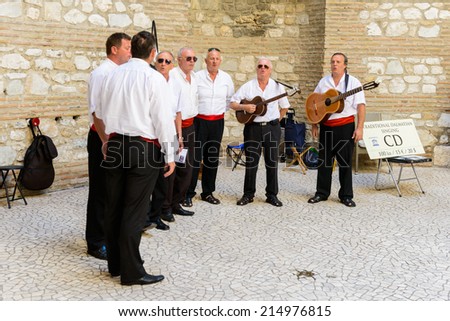 SPLIT, CROATIA - AUG 22, 2014: Unidentified local Croatian musicians make sing the traditional song in Split, Croatia. Split is the largest city of the region of Dalmatia