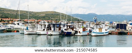 CIOVO, CROATIA - AUG 22, 2014: Boats on the Adriatic Sea near the coast of Ciovo, small Croatian Island. Ciovo is an island in the Adriatic Sea with area of 28.8 km2