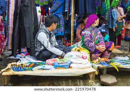 BAC HA, VIETNAM - SEP 21, 2014: Tents of the Bac Ha Market, a large Sunday market with people wearing beautiful colored minorities costumes