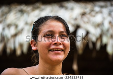 AMAZONIA, PERU - NOV 10, 2010: Unidentified Amazonian indigenous girl. Indigenous people of Amazonia are protected by COICA (Coordinator of Indigenous Organizations of the Amazon River Basin)