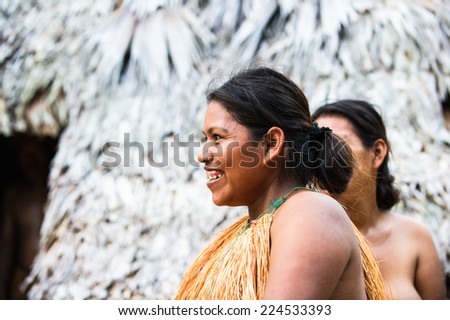 AMAZONIA, PERU - NOV 10, 2010: Unidentified Amazonian indigenous two women laugh.Indigenous people of Amazonia are protected byCOICA (Coordinator of Indigenous Organizations of the Amazon River Basin)