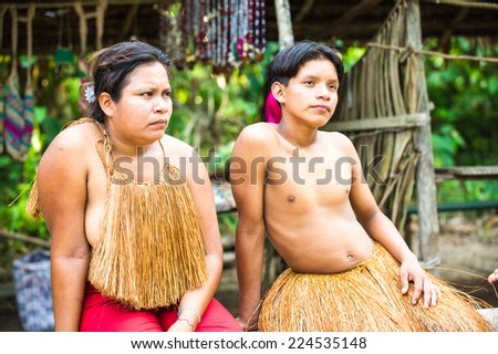 AMAZONIA, PERU - NOV 10, 2010: Unidentified Amazonian indigenous family. Indigenous people of Amazonia are protected by COICA (Coordinator of Indigenous Organizations of the Amazon River Basin)