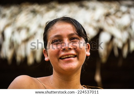 AMAZONIA, PERU - NOV 10, 2010: Unidentified Amazonian indigenous girl. Indigenous people of Amazonia are protected by COICA (Coordinator of Indigenous Organizations of the Amazon River Basin)