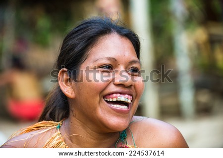AMAZONIA, PERU - NOV 10, 2010: Unidentified Amazonian indigenous smiling beautiful girl. Indigenous people of Amazonia are protected by  COICA (Coordinator of Indigenous Org of the Amazon River Basin)