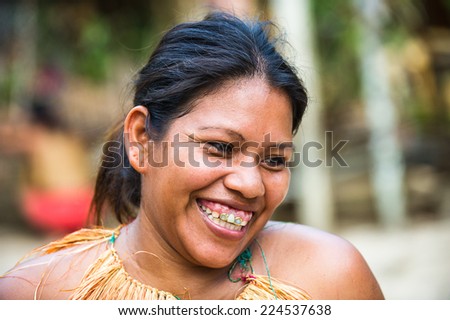 AMAZONIA, PERU - NOV 10, 2010: Unidentified Amazonian indigenous smiling beautiful girl. Indigenous people of Amazonia are protected by  COICA (Coordinator of Indigenous Org of the Amazon River Basin)