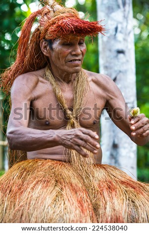 AMAZONIA, PERU - NOV 10, 2010: Unidentified Amazonian indigenous man portrait. Indigenous people of Amazonia are protected by  COICA (Coordinator of Indigenous Organizations of the Amazon River Basin)
