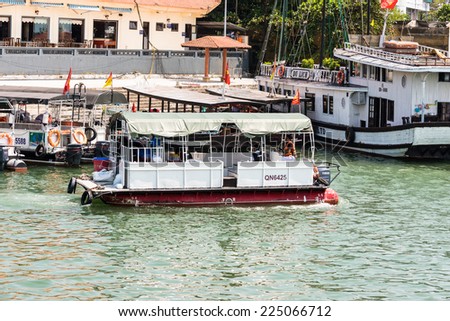 HA LONG CITY, VIETNAM - SEP 23, 2014: Touristoc Boats near the port of the Halong city where many touristic boat start jorneys over the Halong bay which is UNESCO World heritage