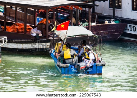 HA LONG CITY, VIETNAM - SEP 23, 2014: Touristoc Boats near the port of the Halong city where many touristic boat start jorneys over the Halong bay which is UNESCO World heritage